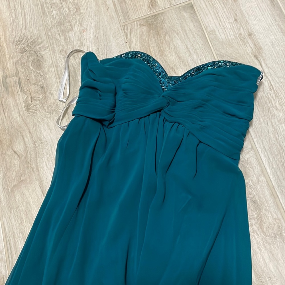 Davids bridal size 2, style F14867. Color is a greenish teal.